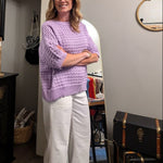 Woman standing in a room with furniture and decor
